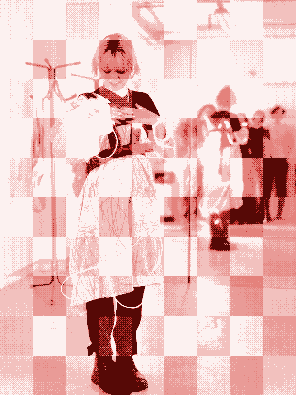 a classmate wearing the dress at the exhibition